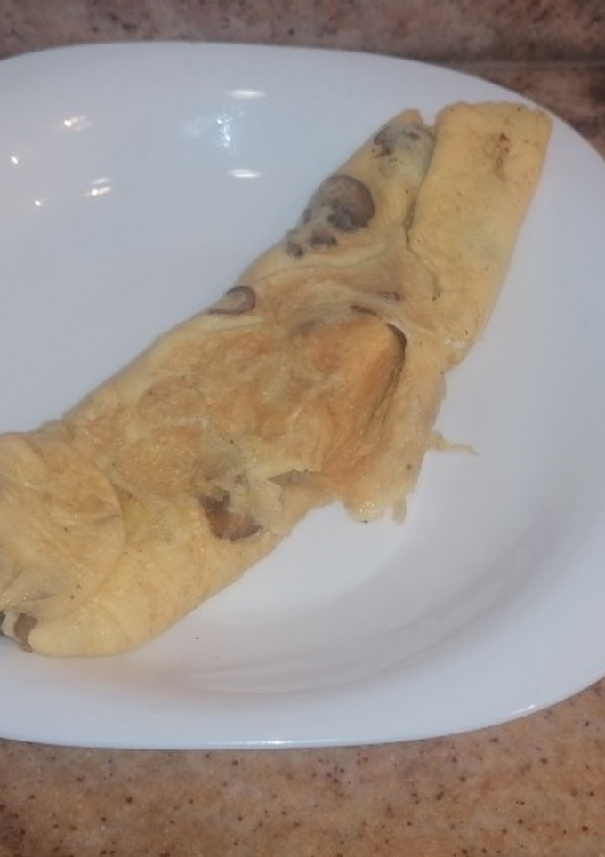 Una foto de Tortilla de boletus y champiñón