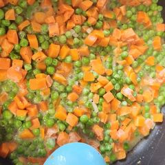 A picture of Garlic Butter Peas and Carrots.