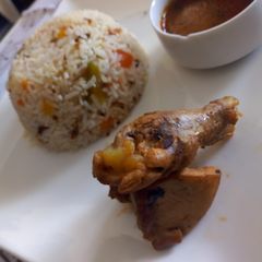 A picture of Smoked chicken with pepper rice.