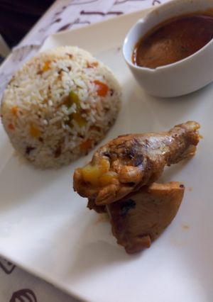 A picture of Smoked chicken with pepper rice.