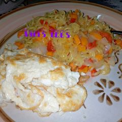 A picture of Noodles with fried egg.