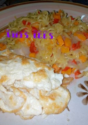 A picture of Noodles with fried egg.