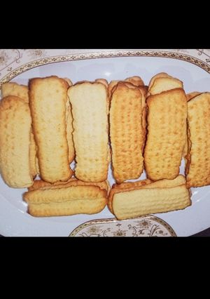 صورة لوصفة بسكويت العيد بالبرتقال والنشادر بمكون سري لطعم مفيش منه 😋♥️
