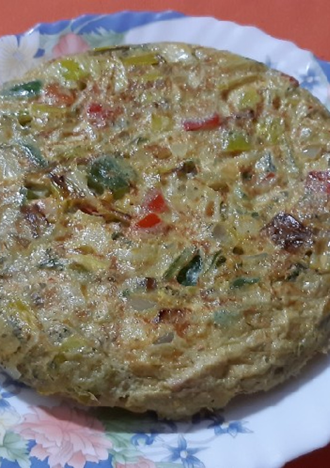 Una foto de Tortilla de puerro y pimientos