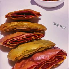 A picture of Multi layered beet spinach crackers.