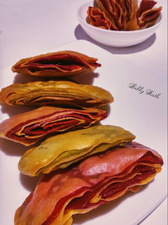A picture of Multi layered beet spinach crackers.