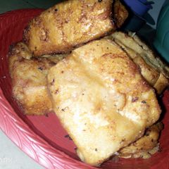 A picture of Bread coated with akara paste.