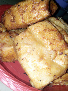 A picture of Bread coated with akara paste.