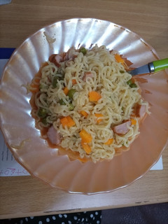 A picture of Veggie Indomie and sausage.