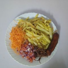 A picture of Home made fries with onion rings and Kachumbari.