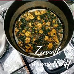 A picture of Harey Bharey Jhinge or Prawns with Amaranthus Leaves.
