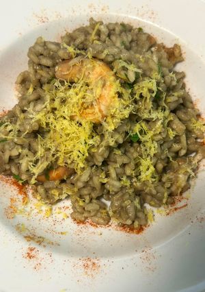 A picture of Risotto with Squid Ink and Shrimp.