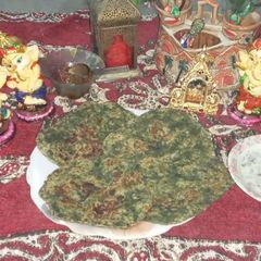 A picture of Bathua or chenopodium paratha and raita make Winter platter.