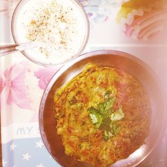A picture of Moong dal cheela with dahi.