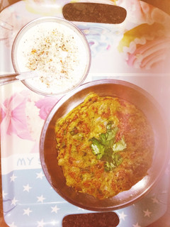 A picture of Moong dal cheela with dahi.