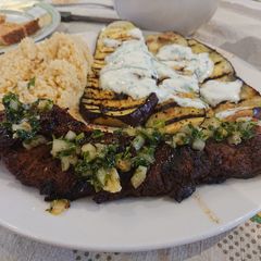A picture of Roasted Pork Tenderloin with a Herb Sauce.