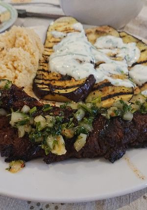 A picture of Roasted Pork Tenderloin with a Herb Sauce.
