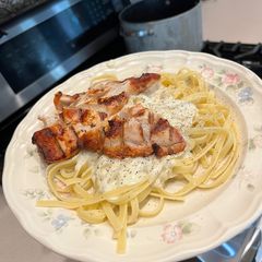 A picture of Grilled Chicken with Alfredo Sauce.