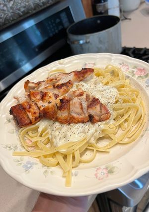 A picture of Grilled Chicken with Alfredo Sauce.