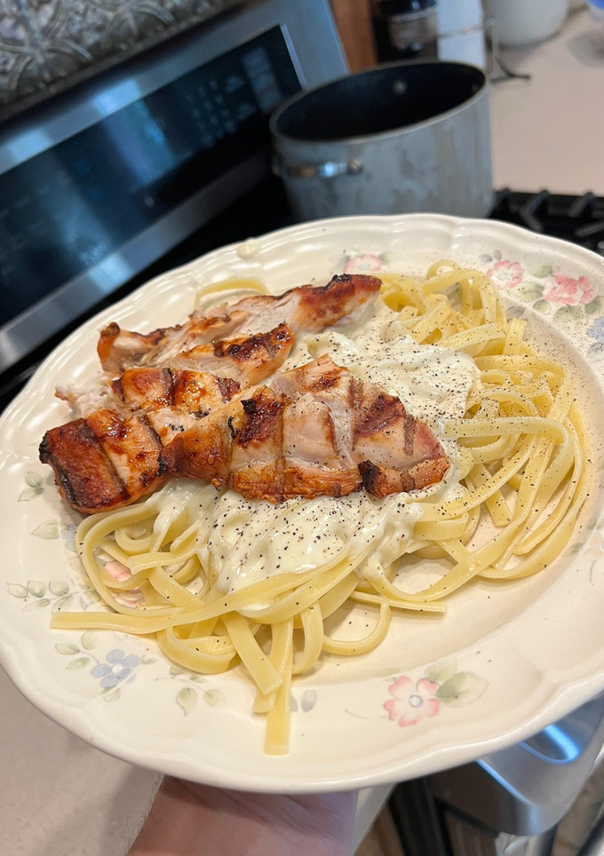 A picture of Grilled Chicken with Alfredo Sauce.