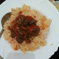 A picture of Wet fried beef with rice.