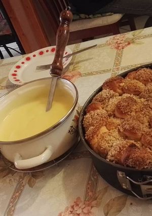 A picture of Golden Dumplings with Vanilla Sauce.