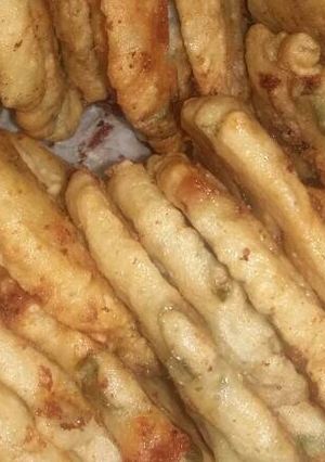 Una foto de Tortilla con hojas de cebolla
