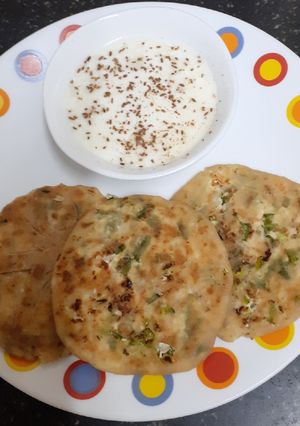 A picture of Paneer Paratha with Spring Onions.