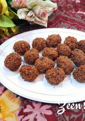 A picture of Ghee Residue and Jaggery Laddoos.