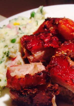 A picture of Crackin' Pork Belly with Spinach-Bacon Mash.