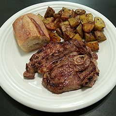 A picture of Grilled Lamb Steak with Italian Roasted Potatoes.