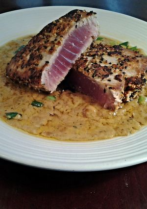 A picture of Peanut Sesame Crusted Tuna with Wasabi Cream Sauce.
