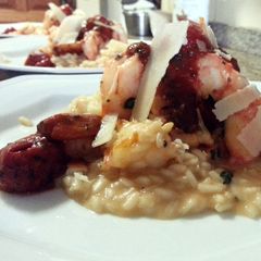 A picture of Shrimp Risotto and Cherry Tomatoes.
