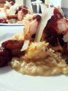 A picture of Shrimp Risotto and Cherry Tomatoes.