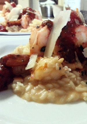 A picture of Shrimp Risotto and Cherry Tomatoes.
