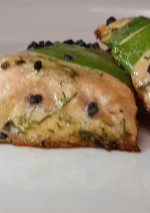 A picture of leek wrapped salmon w black hawaiian sea salt.