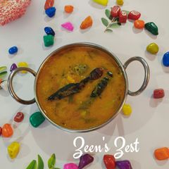 A picture of Red Amaranthus and Raw Mango Daal.