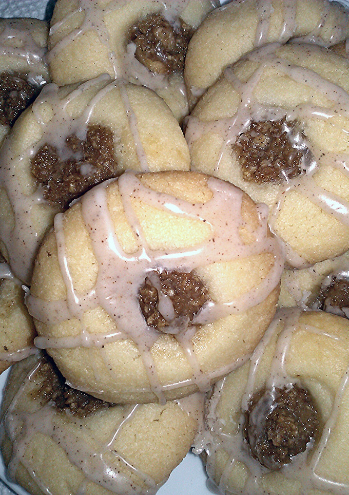 A picture of Raspberry Thumbprint Cookies With Lemon Icing.