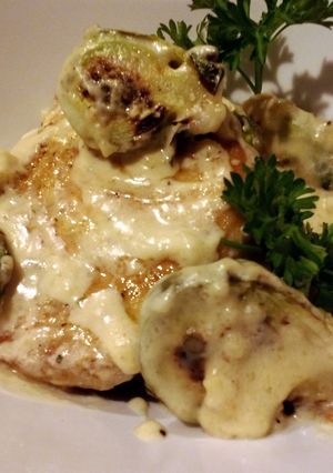 A picture of Sauteed pork and brussels sprouts in cream sauce.
