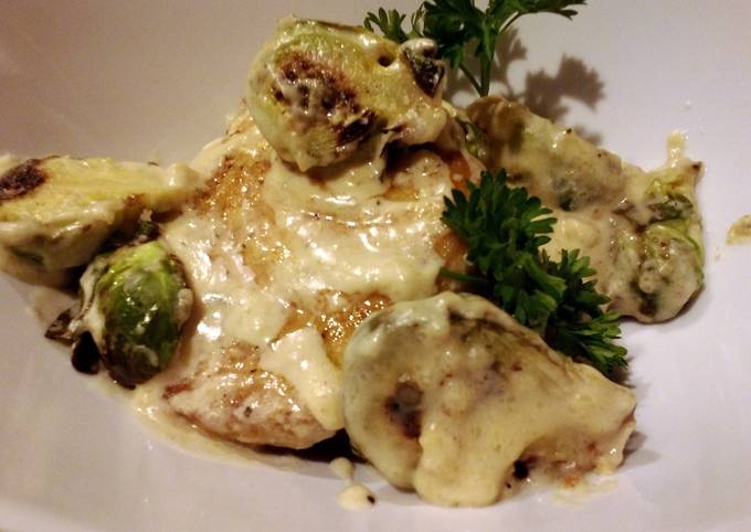 Sauteed pork and brussels sprouts in cream sauce