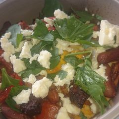 A picture of Baked eggs with chorizo and feta.