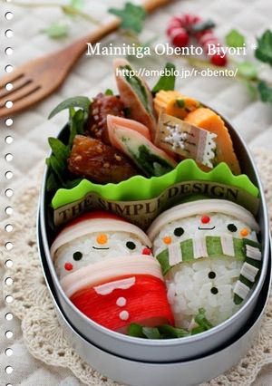A picture of Cylinder Shaped Onigiri Rice Balls: Santa Christmas Bento.