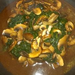 A picture of Sauteed spinach and mushrooms.