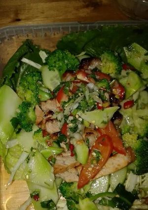 A picture of 3?flavours bbq pork with broccoli stems.