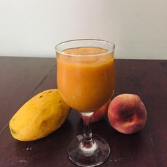 A picture of Mango and peaches 🍑 smoothie.