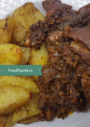A picture of Peppered GOAT meat and potatoes.