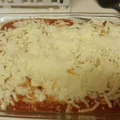 A picture of Garlicky Chicken and pepperoni Parmesan bake.