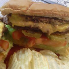 A picture of sunshine 's three cheeses stuffed burgers.
