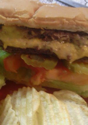 A picture of sunshine 's three cheeses stuffed burgers.