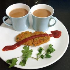 A picture of Veg Besan Chilla with Chai.